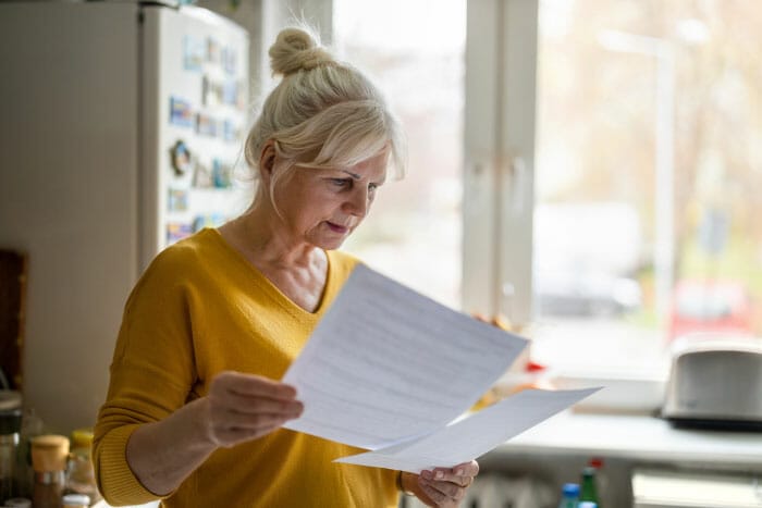 woman reviewing a financial statement.